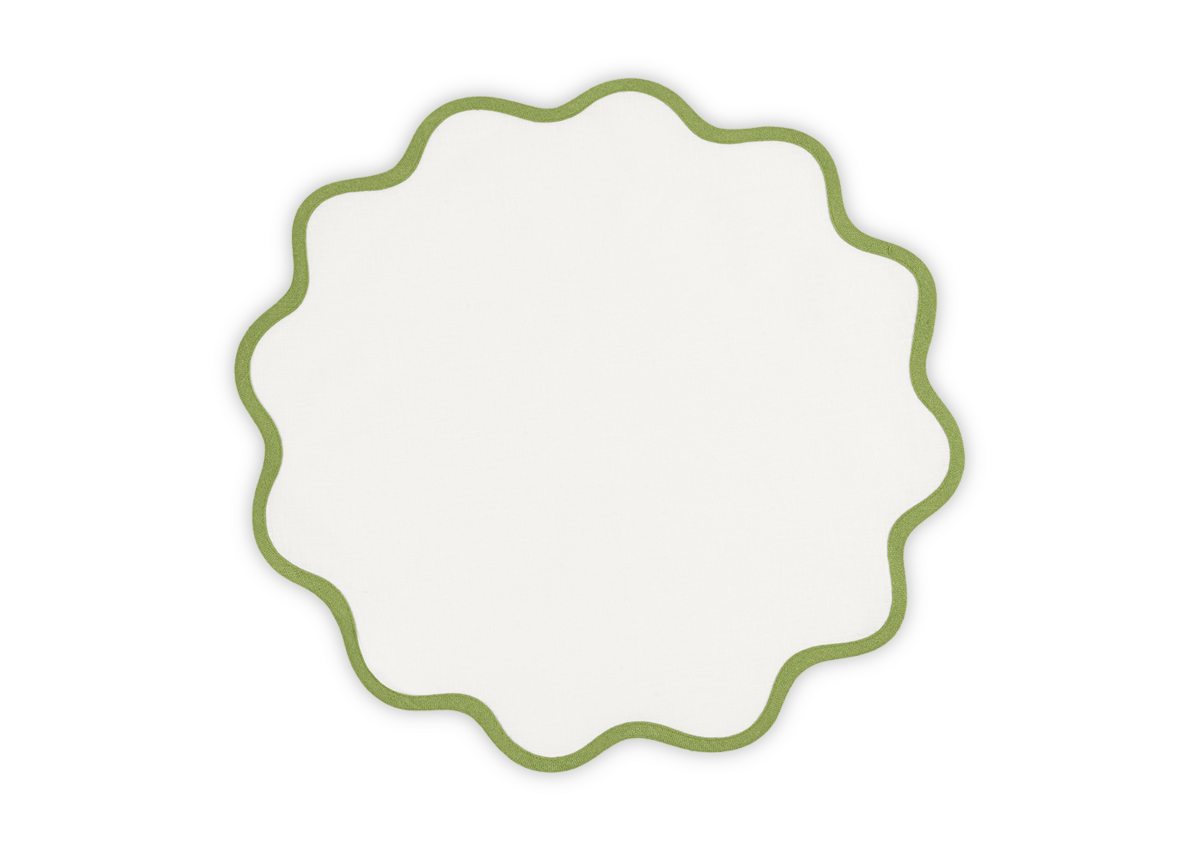 The Scallop Edge Placemat Set by Matouk features round, white linen placemats with green scalloped edges—perfect for a unique tablescape and photographed on a plain background.