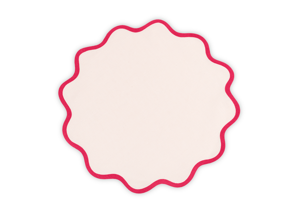 The Scallop Edge Placemat Set by Matouk features round, cream linen placemats with red-outlined wavy edges, bringing charm to any unique tablescape. Shown on a plain white background.