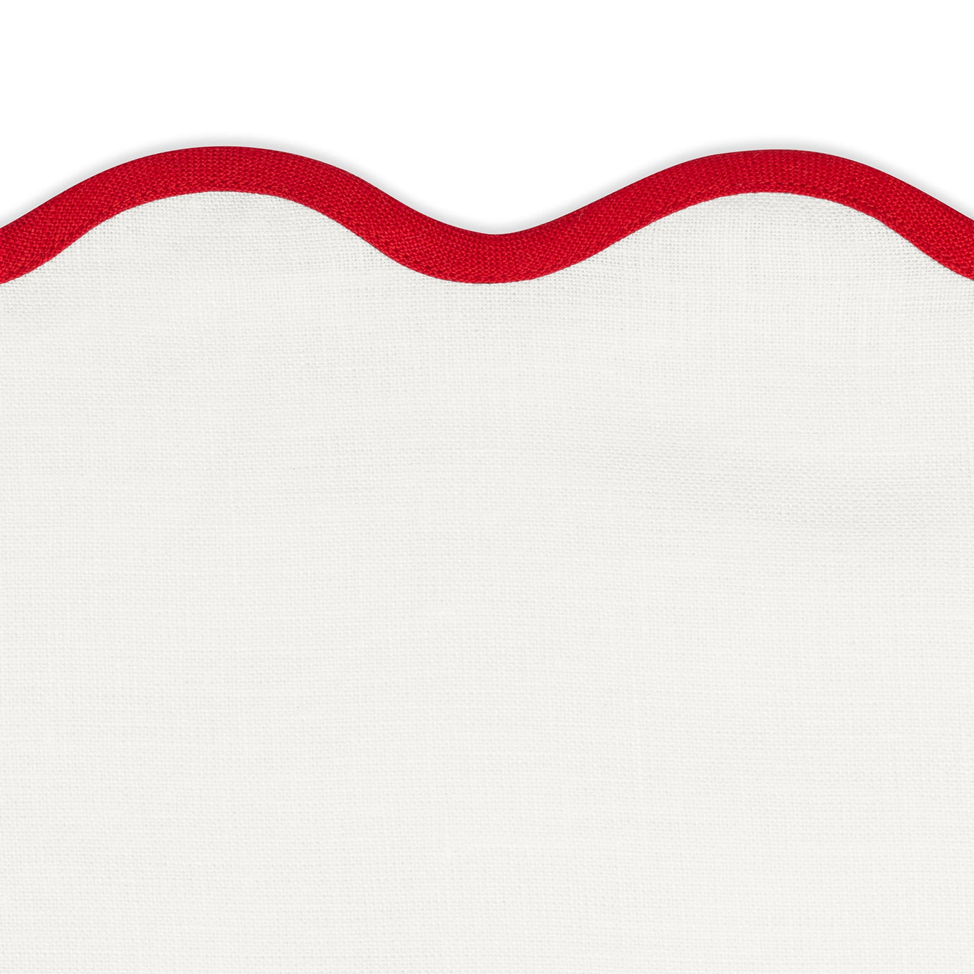 The Matouk Scallop Edge | Napkin Set features white fabric with a wavy red border along the top edge, photographed on a plain white background—ideal for adding a unique touch to your tablescape with linen placemats.