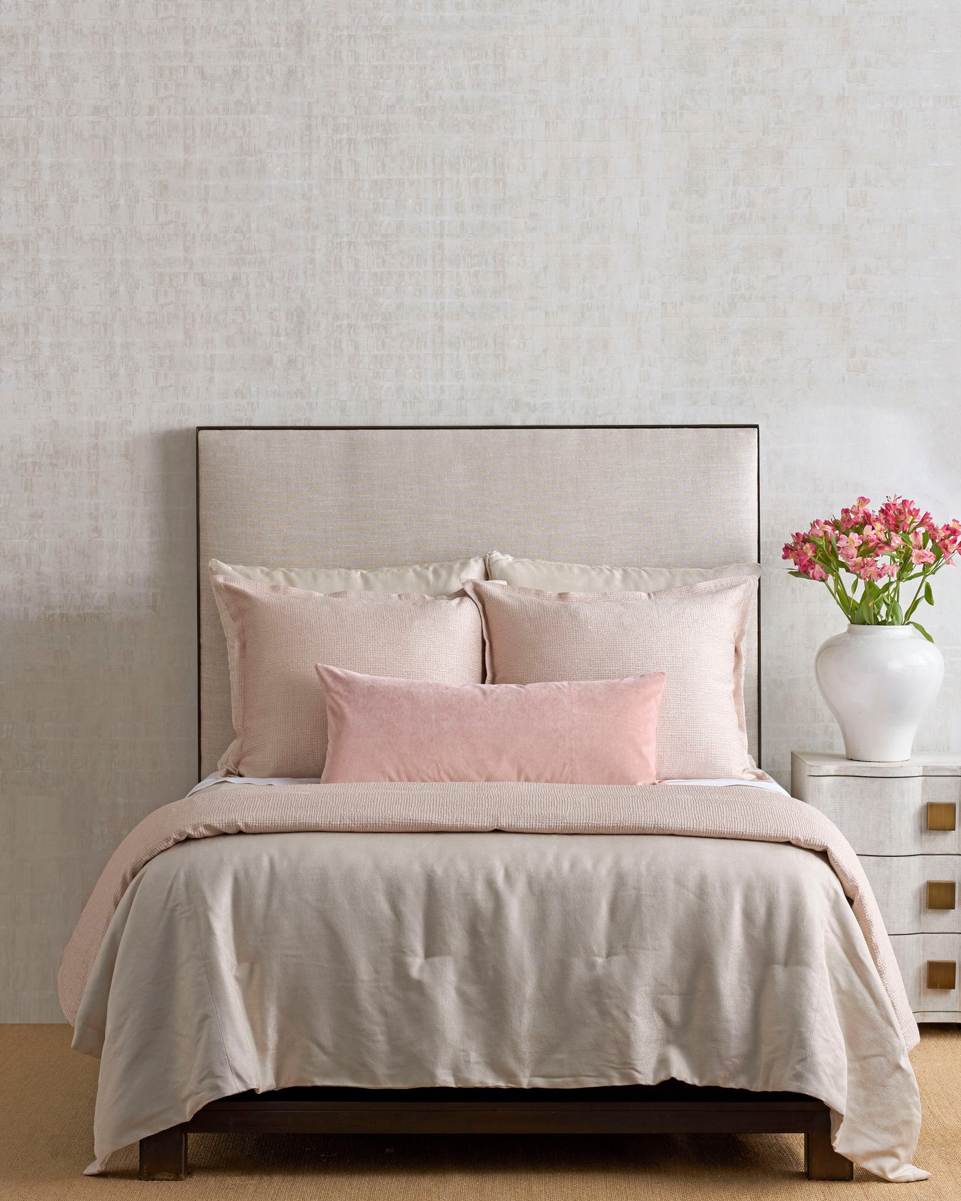 Styled bed with Ann Gish Screen coverlet in warm linen, paired with blush euro shams.