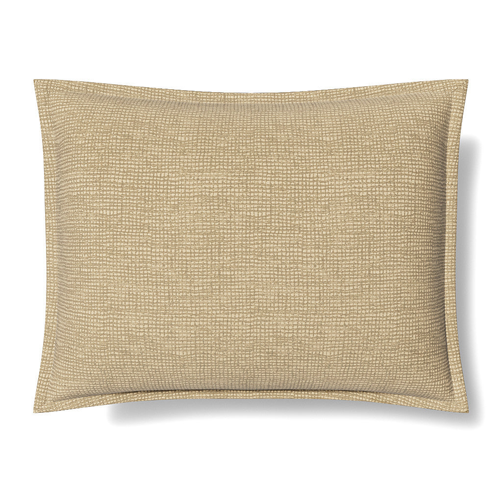 Close-up of Ann Gish Screen pillow in champagne, showing woven metallic texture with flanged edge.