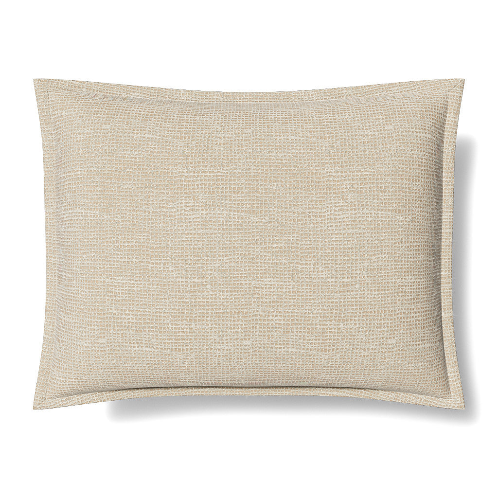 Close-up of Ann Gish Screen pillow in ivory with woven metallic texture and flanged edge.