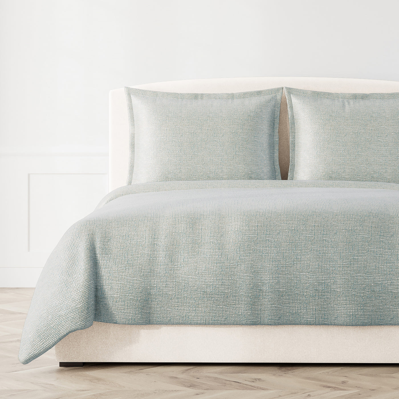 Ann Gish Screen coverlet in soft aqua with subtle textured weave pattern on styled bed.
