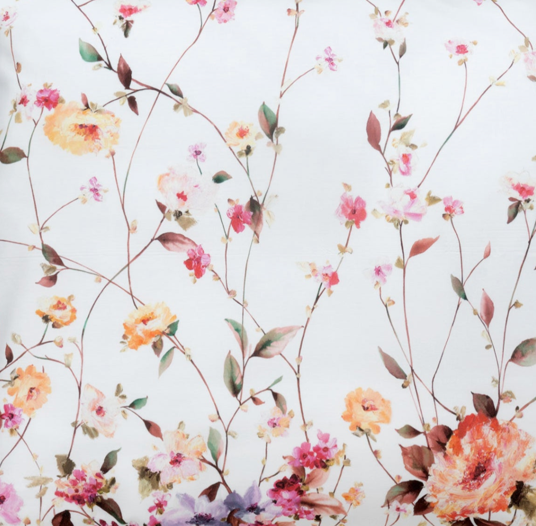 Close-up of Certaldo's watercolour floral print in coral, peach, and pink blooms on white.