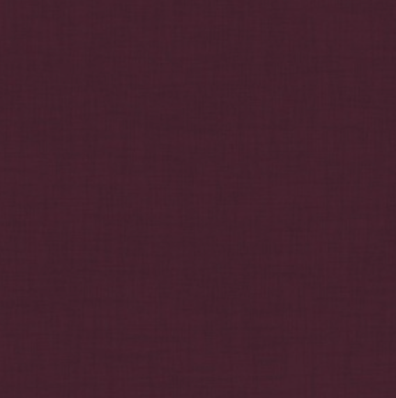 A dark maroon Silk-filled Sleep Mask by Kumi Kookoon, featuring a plain textured surface reminiscent of luxurious silk charmeuse.