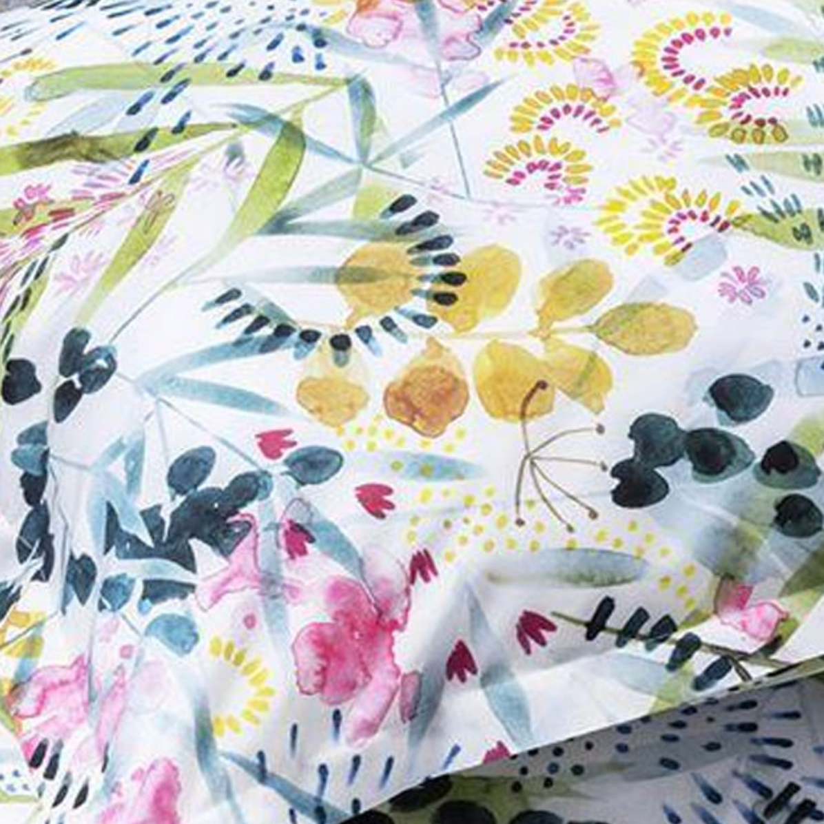 Floral and leaf patterned fabric with colorful design