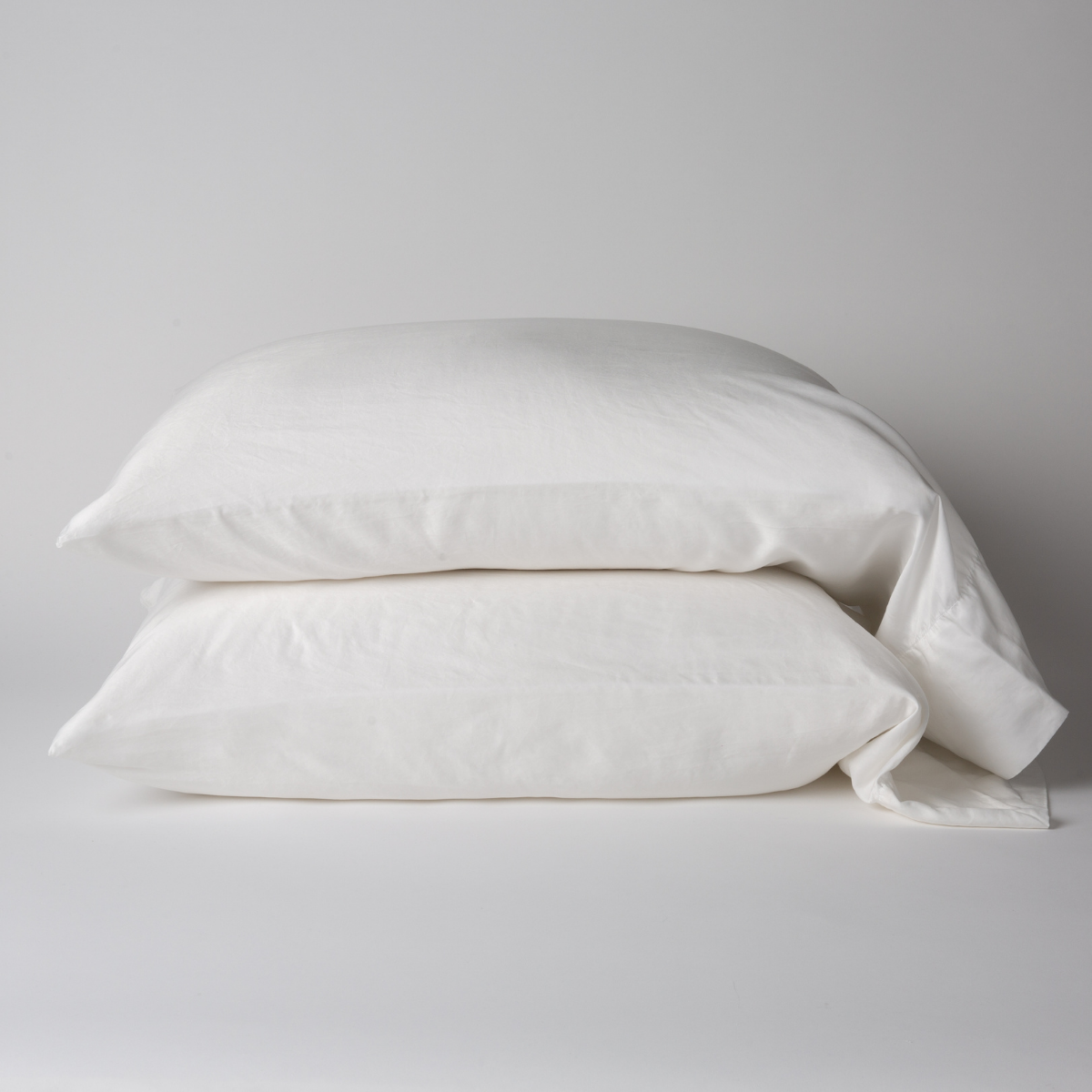 Bella Notte Seraphina pillowcase in White, two stacked on a neutral surface.