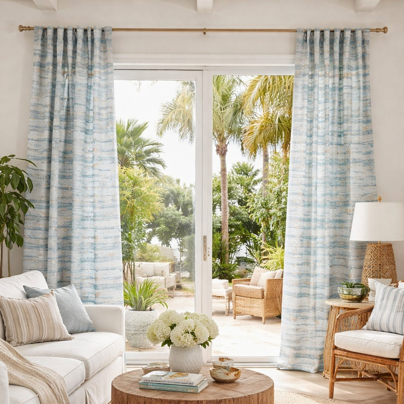 Coastal living room styled with Ann Gish Serenity curtain panels in soft blue watercolor stripe.