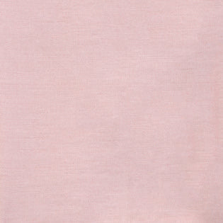 Close-up of blush pink linen weave texture on Sferra Festival cocktail napkin.