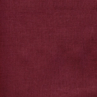 Close-up of Sferra Festival tablecloth fabric in deep burgundy linen weave.