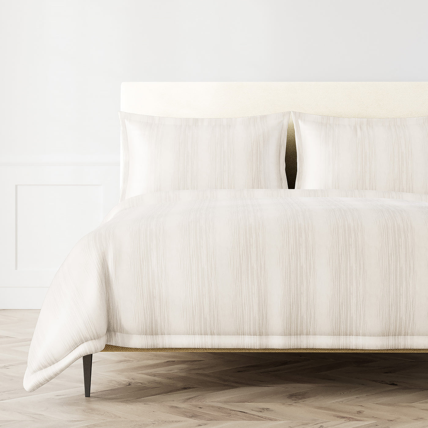Ann Gish Shoreline duvet set in ivory with subtle vertical stripe texture on styled bed.