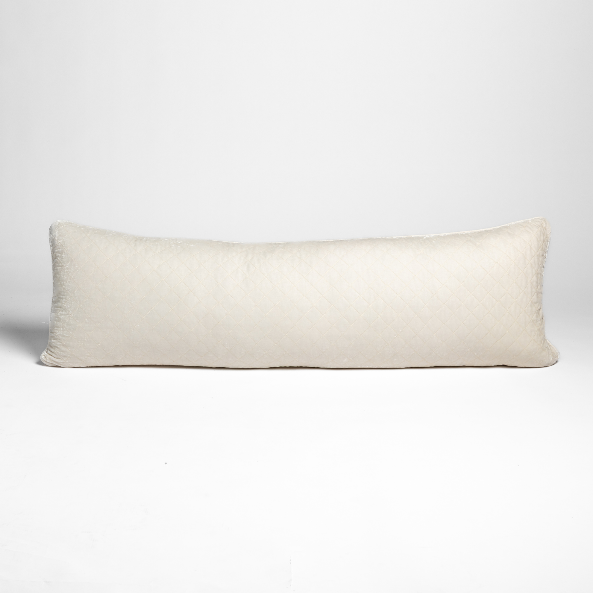 Bella Notte Silk Velvet lumbar pillow in Crema, long rectangular form against white background.