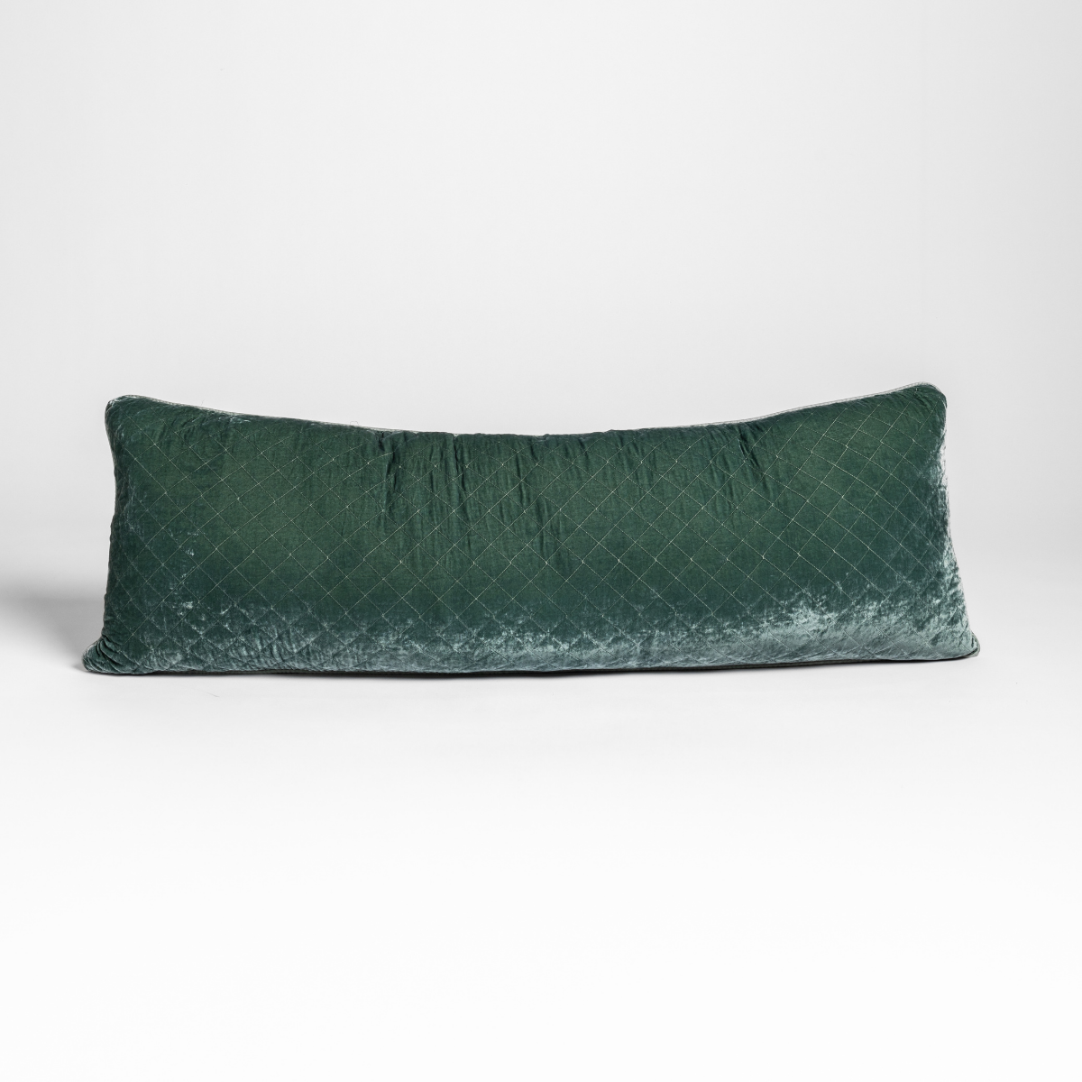 Eucalyptus silk velvet quilted lumbar pillow, long rectangular shape on neutral background.