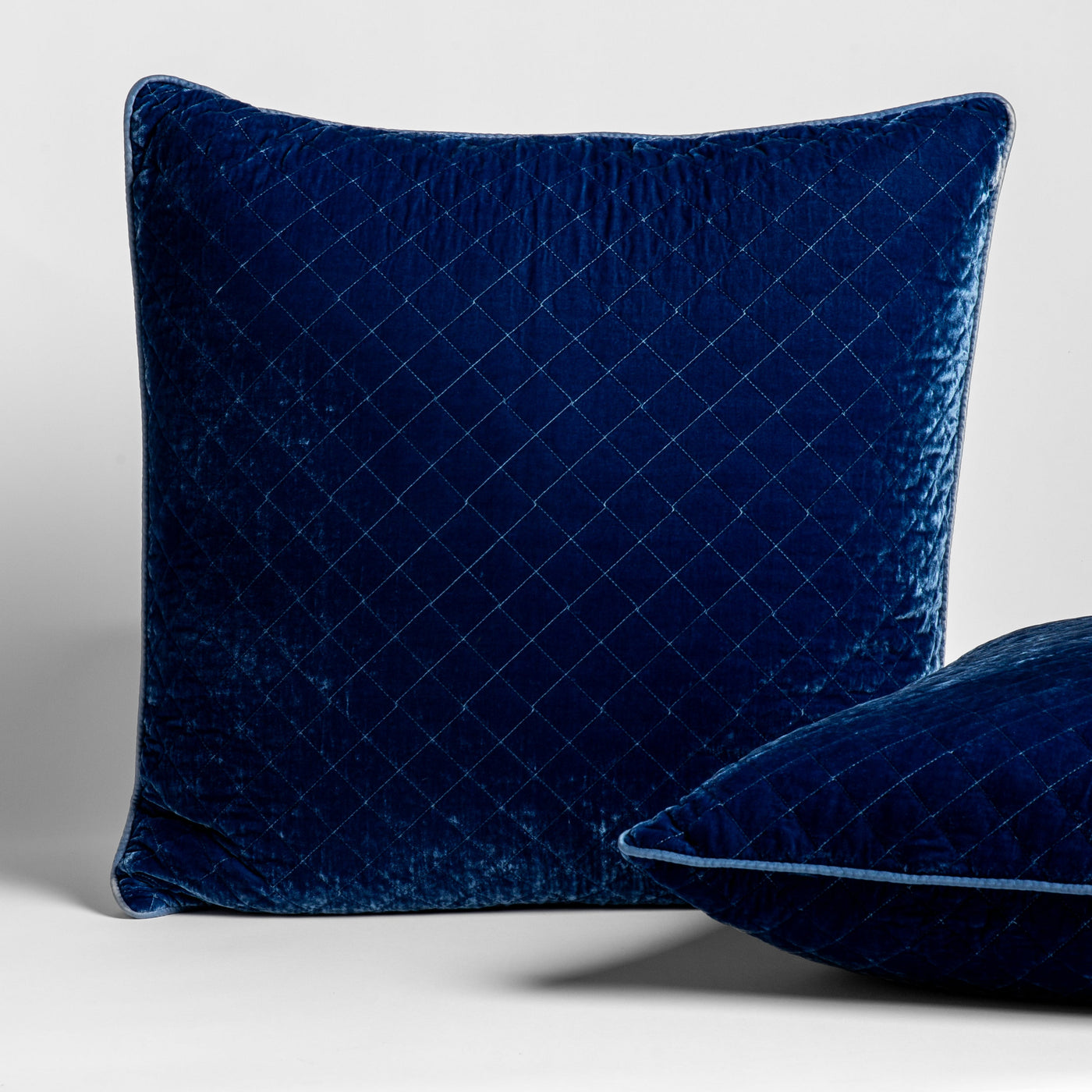 Bella Notte Silk Velvet Quilted Sham in Tahoe Blue, diamond-stitched velvet with piped trim.