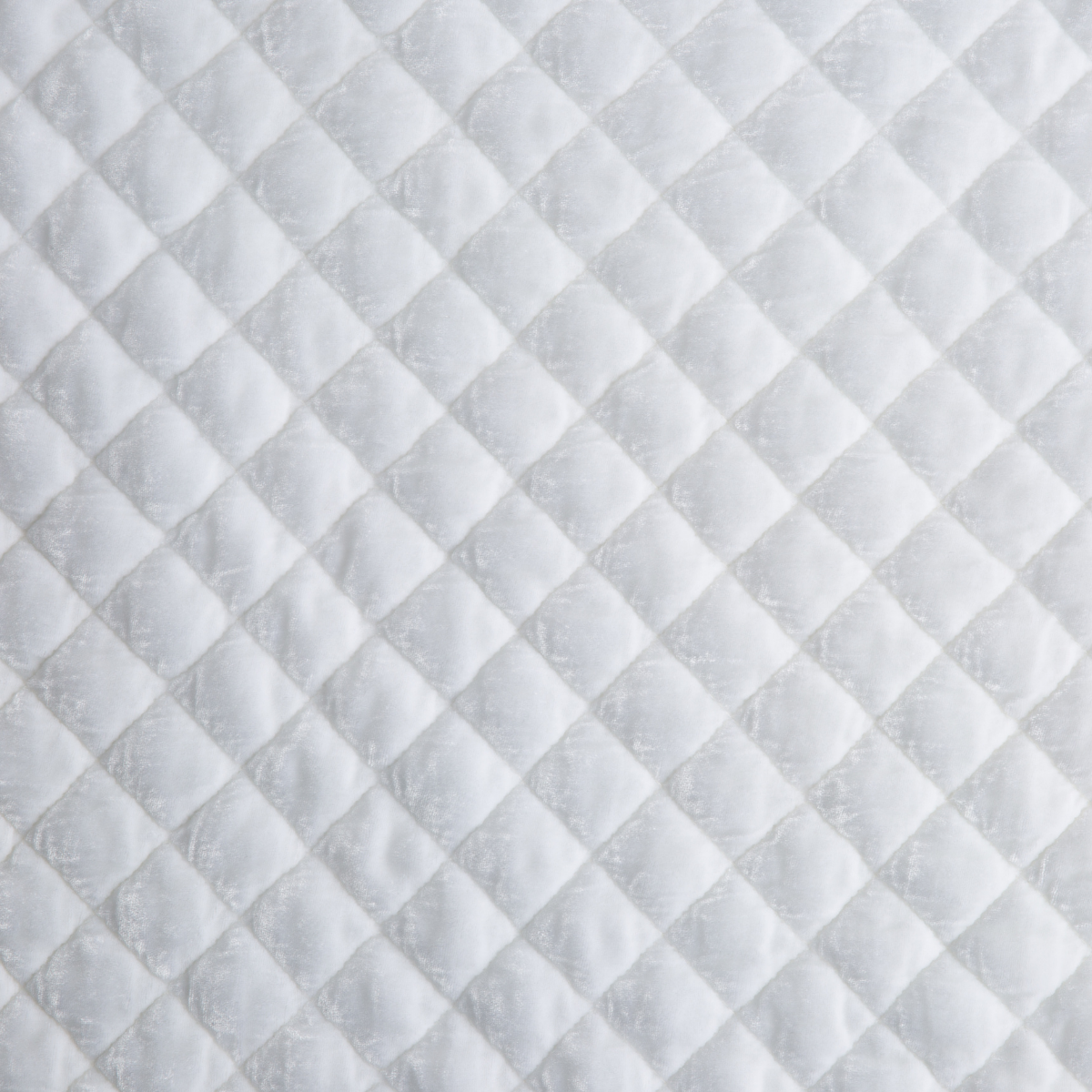 Close-up of White Bella Notte Silk Velvet quilted coverlet showing diamond stitch pattern.