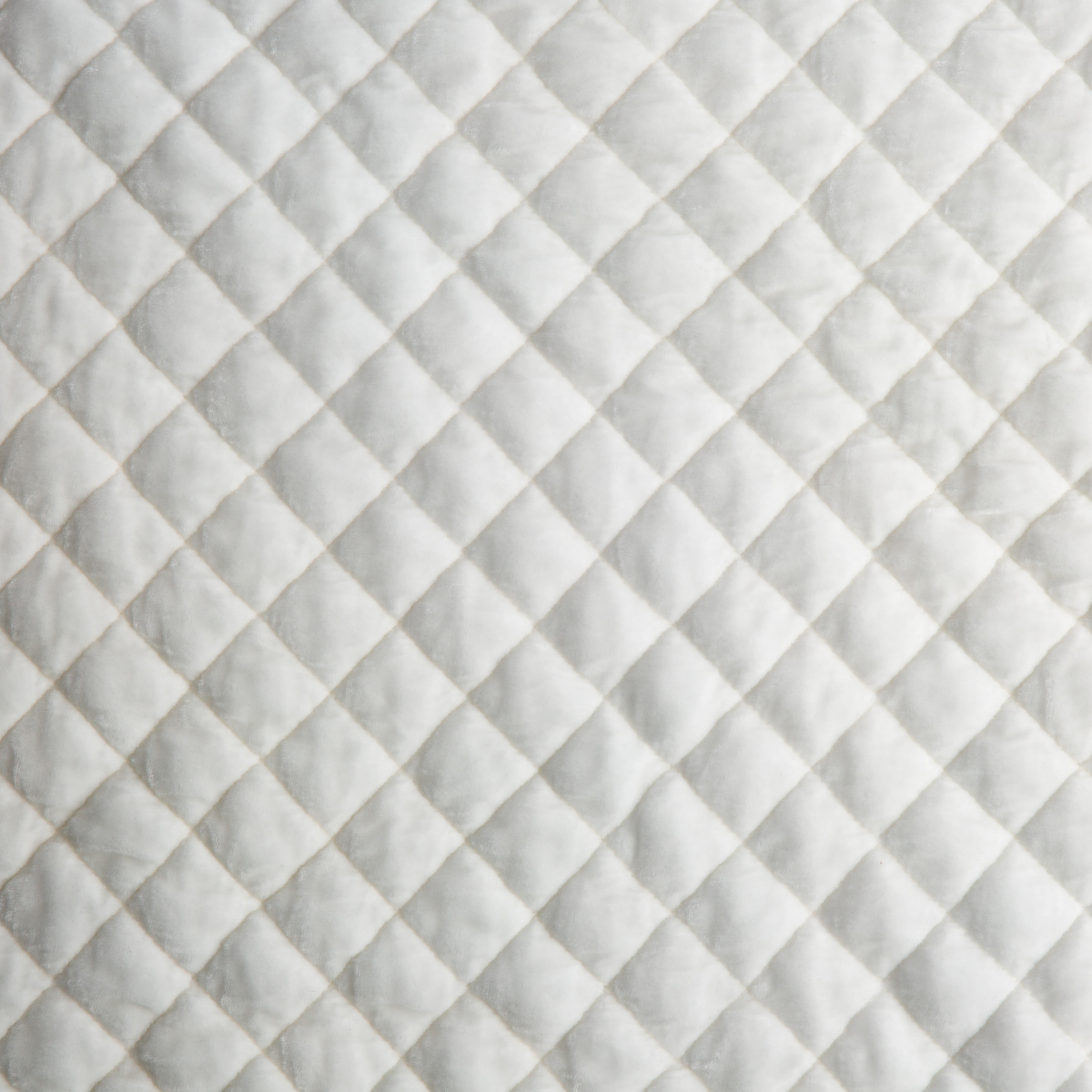 Close-up of Winter White quilted diamond stitching on Bella Notte Silk Velvet pillow.
