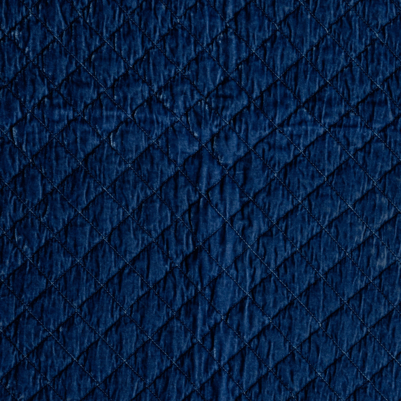 Close-up of Tahoe Blue silk velvet quilted diamond pattern on Bella Notte throw pillow.