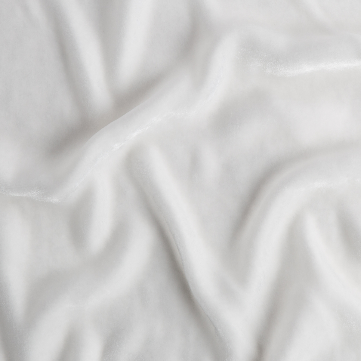 Close-up of Winter White fabric with soft draping and subtle sheen.