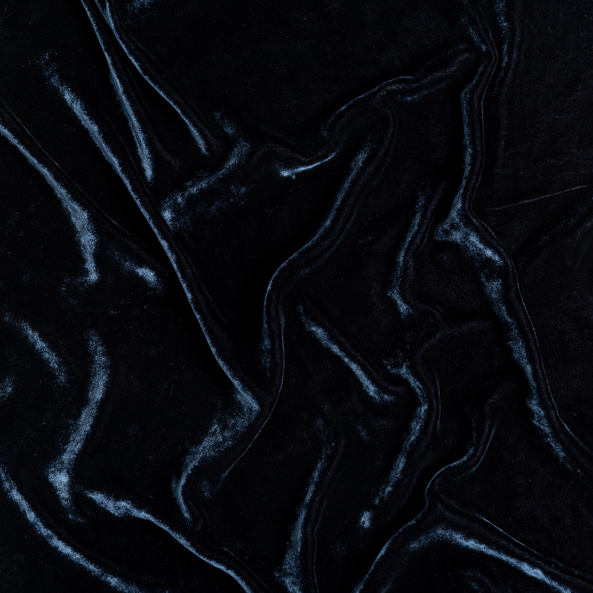 Close-up of draped Midnight velvet fabric showing lustrous sheen and soft folds.