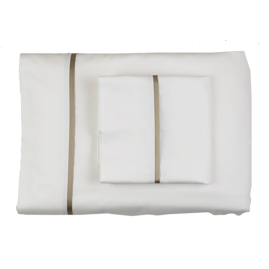 Folded white silk sheet set with taupe satin trim, shown from above with pillowcases stacked on top.