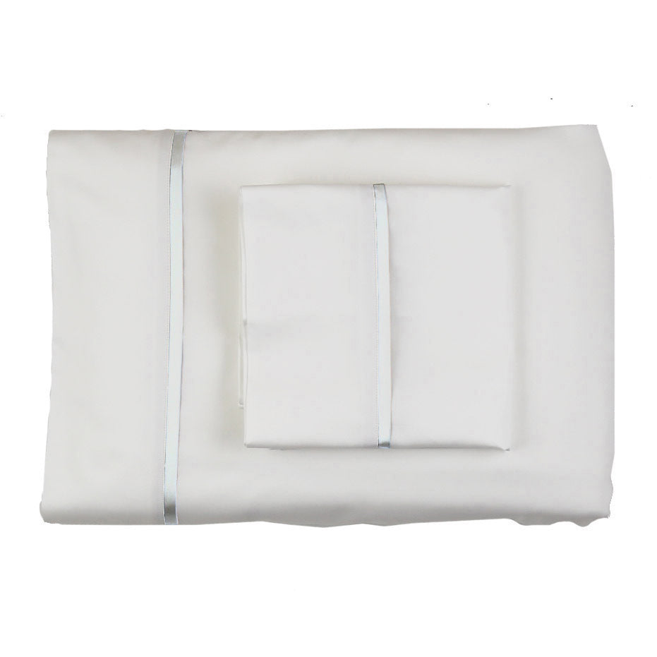 Folded ivory silk sheet set with pale blue satin trim, stacked flat lay view.