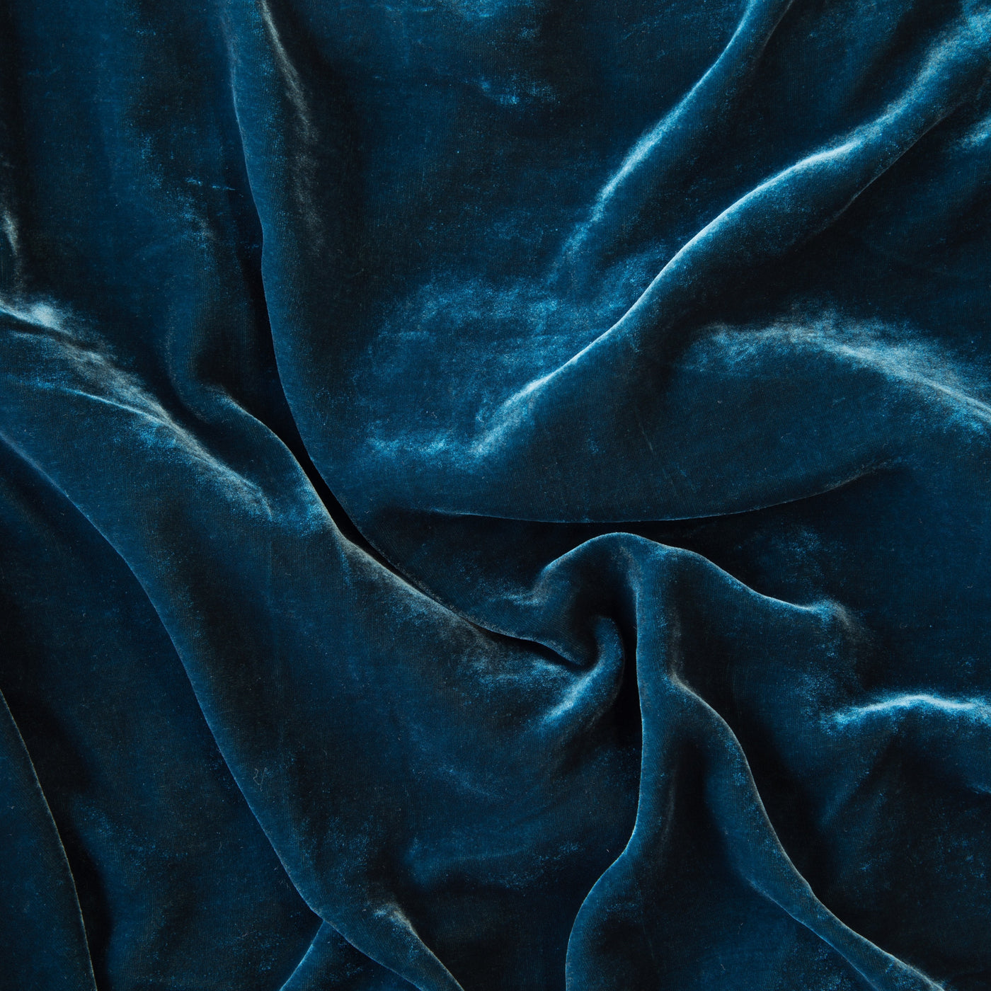 Close-up of Bella Notte Loulah pillow fabric in Cenote, showing draped velvet texture.