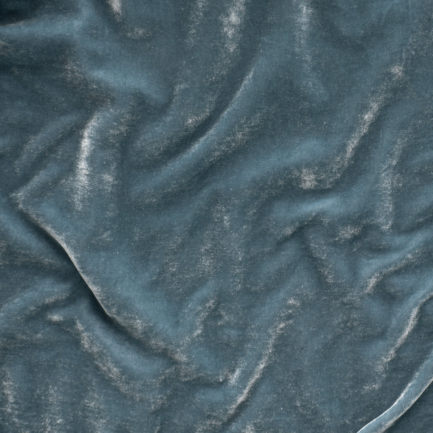 Close-up of Bella Notte Carmen blanket in Cloud, showing draped velvet texture.