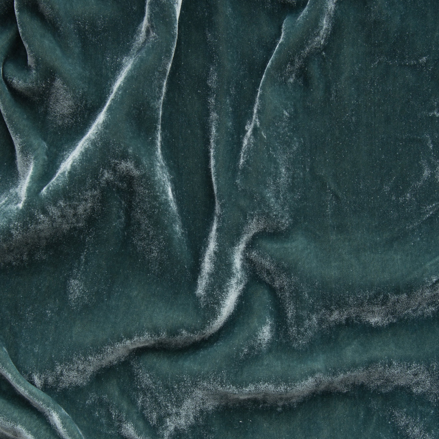Close-up of Eucalyptus velvet fabric with soft folds and luminous sheen.