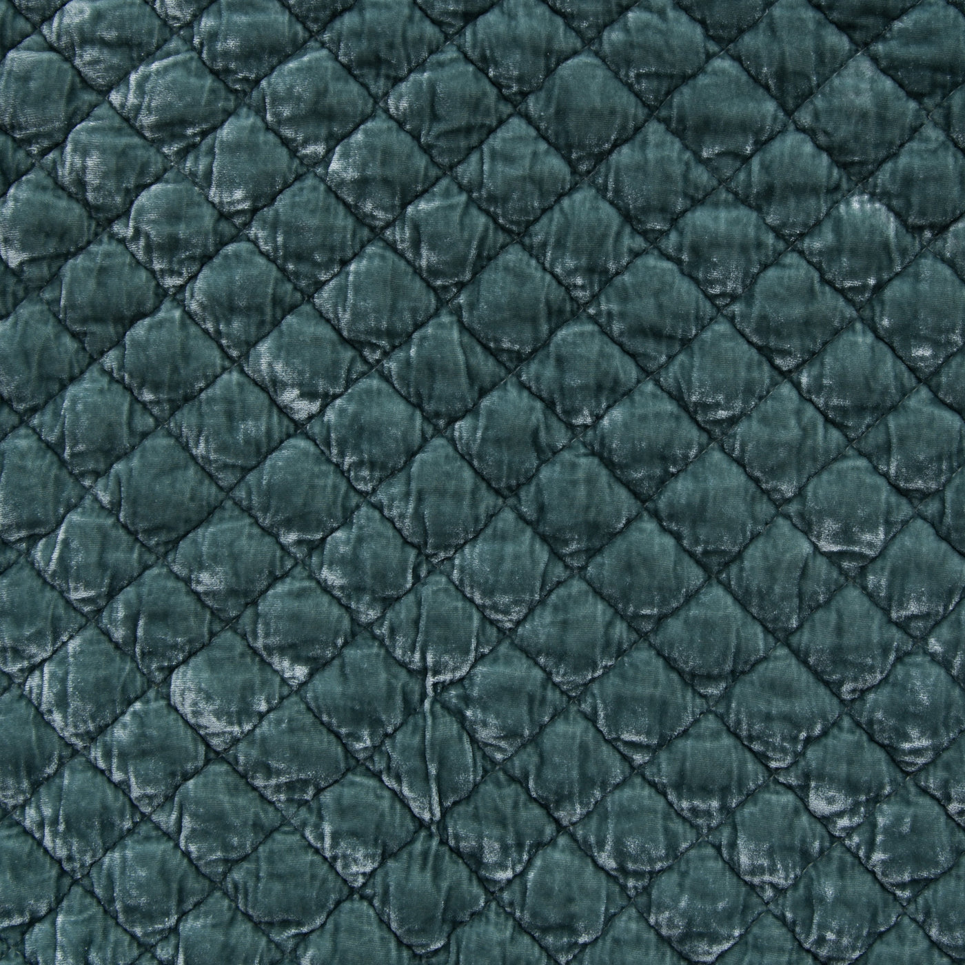 Close-up of Eucalyptus silk velvet quilted in a diamond pattern on a Bella Notte sham.