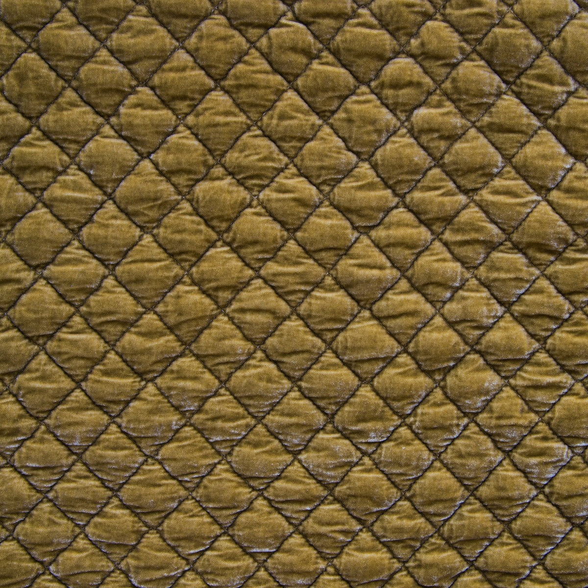 Close-up of Honeycomb silk velvet quilted coverlet showing diamond-stitched pattern.