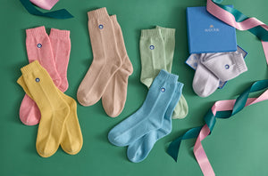 Photo of the The Matouk Sleeping Socks ensemble.