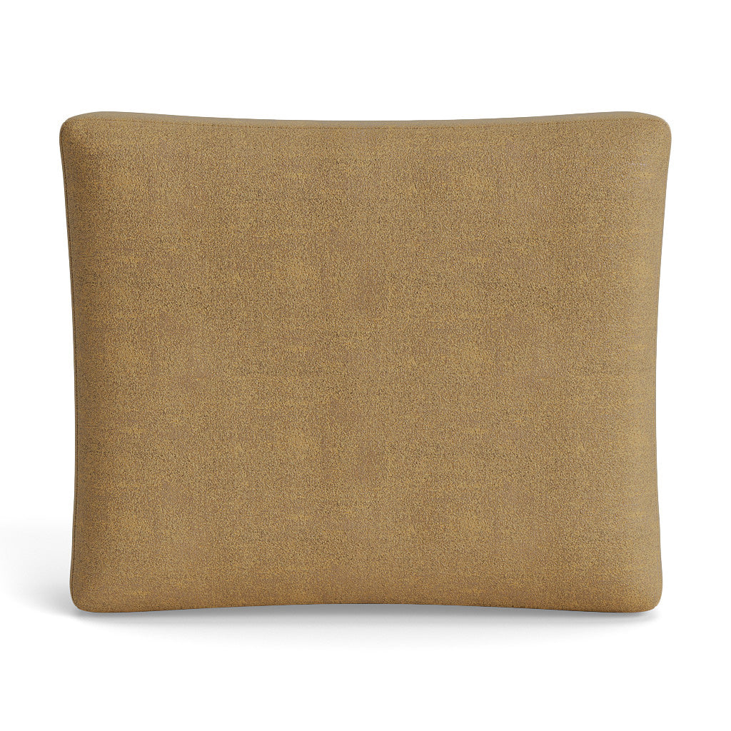 Close-up of Ann Gish Stardust box pillow in golden camel boucle-textured fabric.
