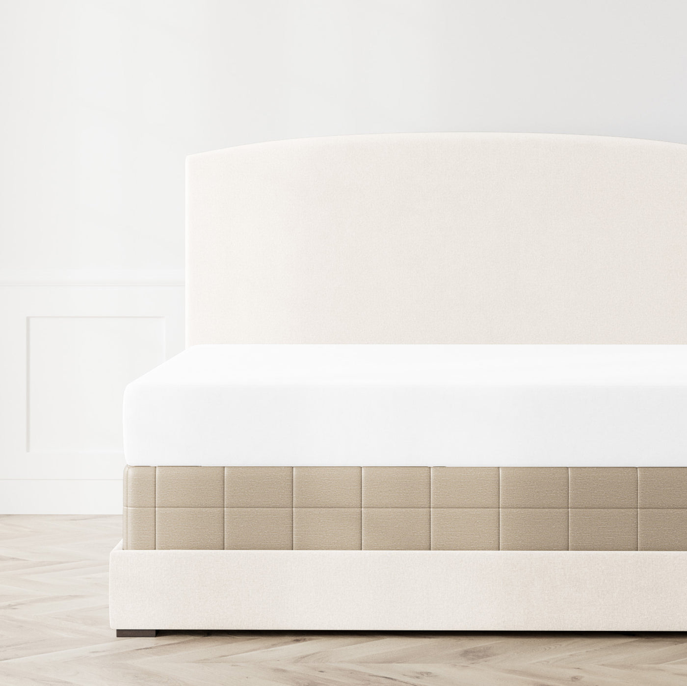 Ann Gish Stria box spring cover in taupe, styled on upholstered bed frame.