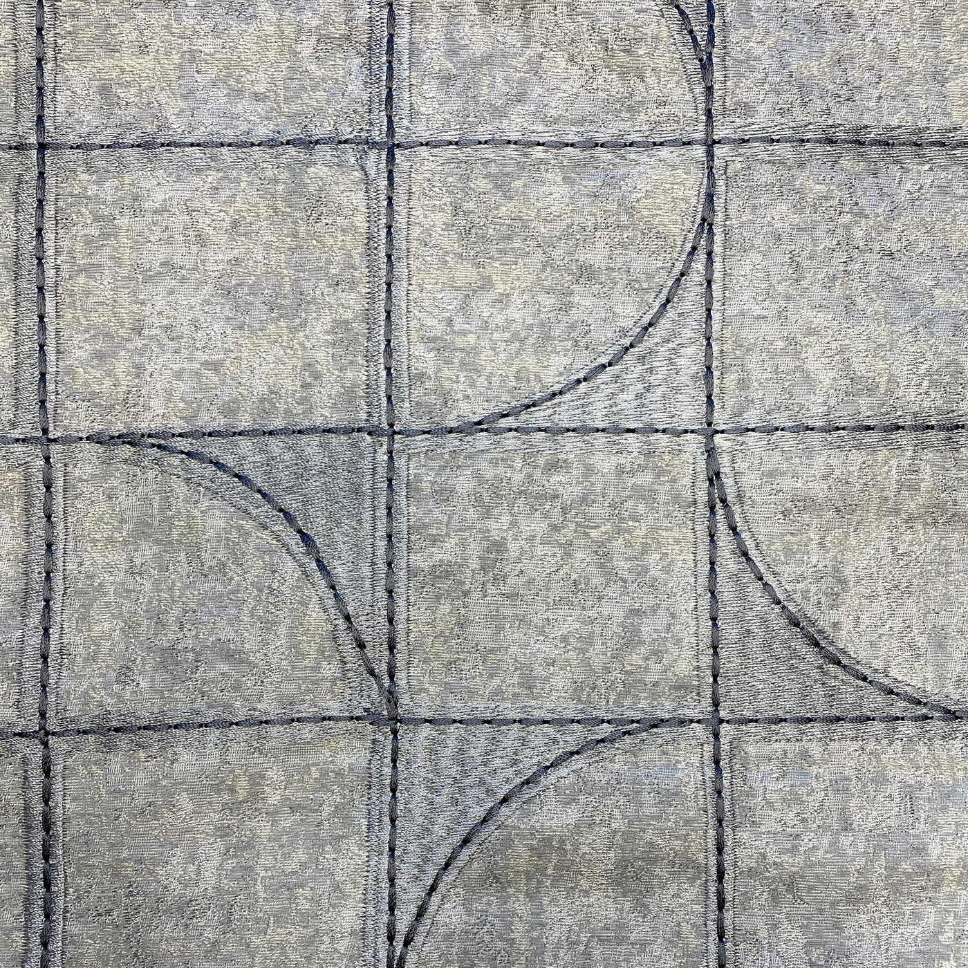 Ann Gish Capsule duvet cover in silver grey with navy geometric arc and grid embroidery.