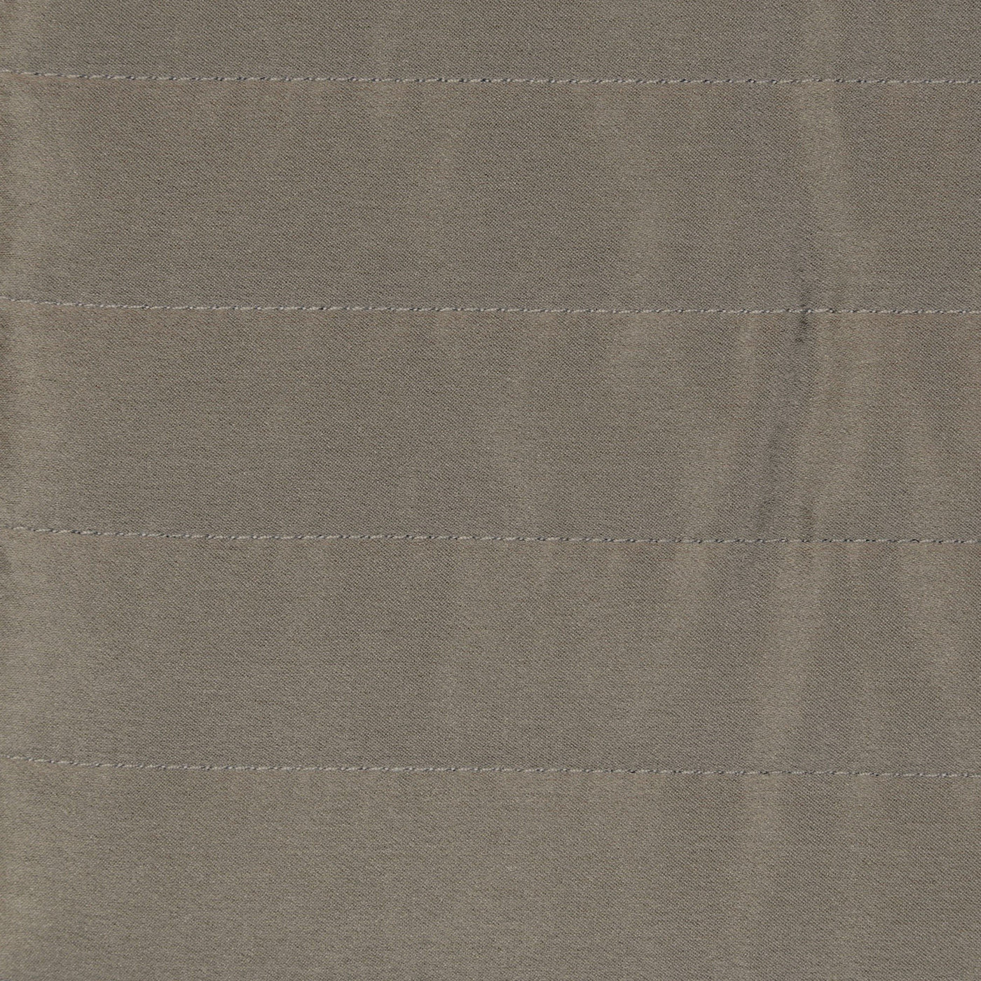 Close-up of taupe charmeuse fabric with horizontal channel quilting stitching detail.
