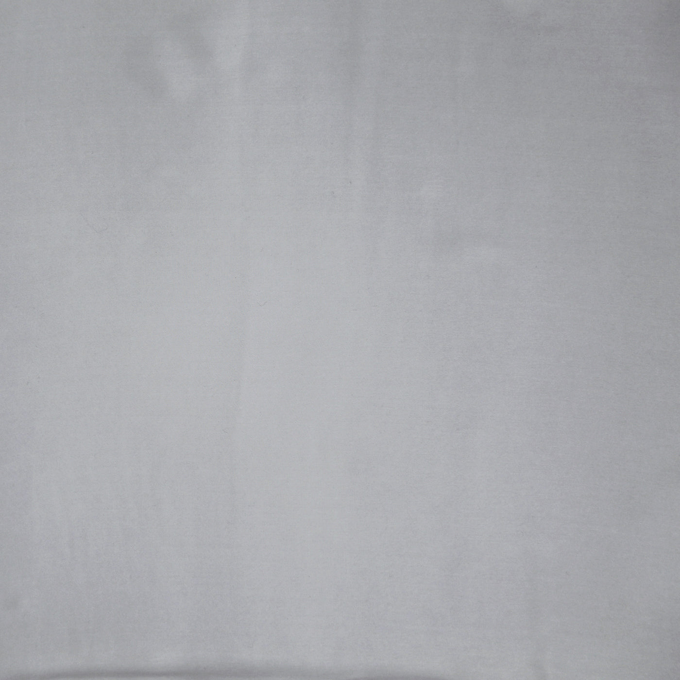 Close-up of Ann Gish Charmeuse duvet cover in silver, showing smooth satin weave texture.