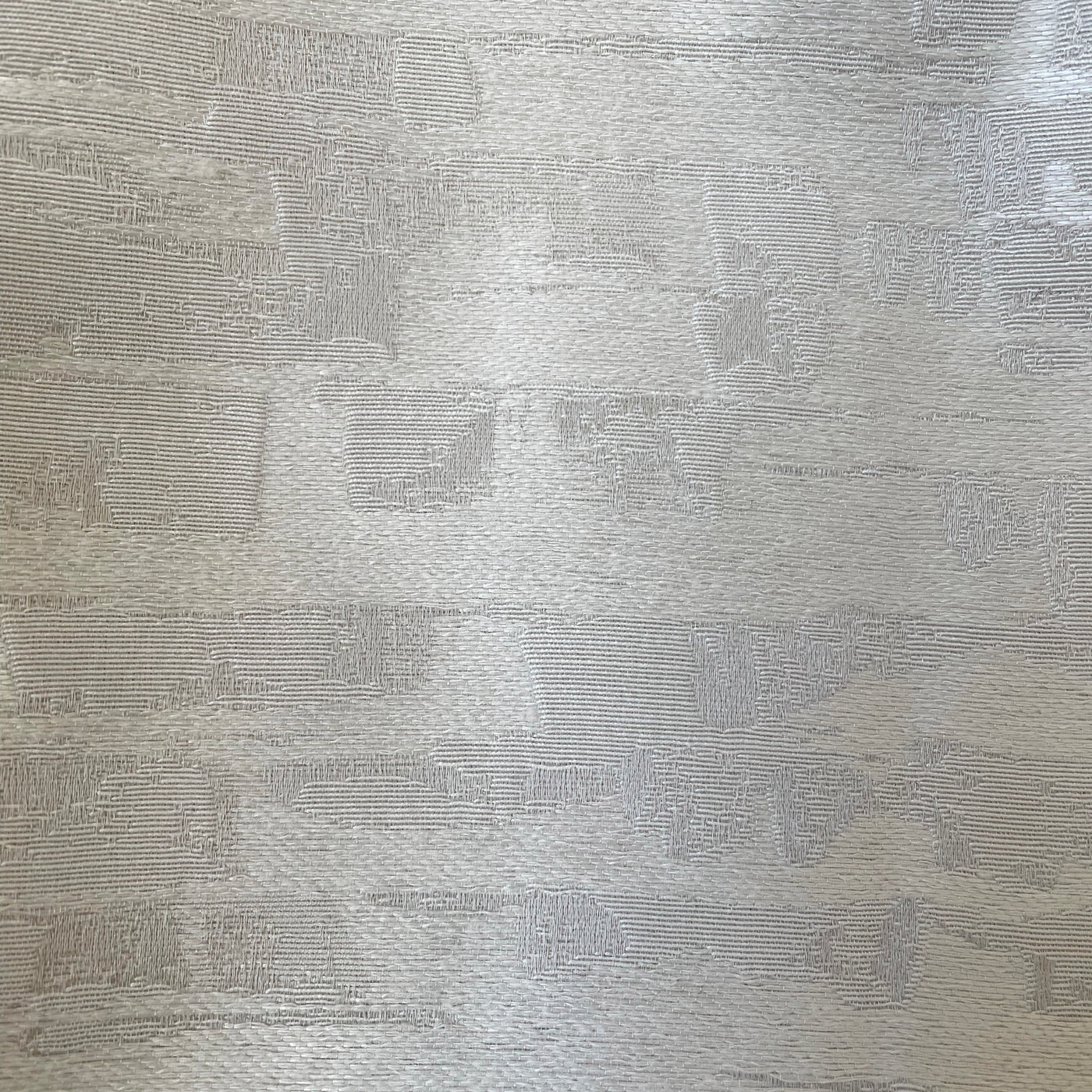 Close-up of Ann Gish Delphi duvet cover fabric in silver, showing jacquard weave texture.