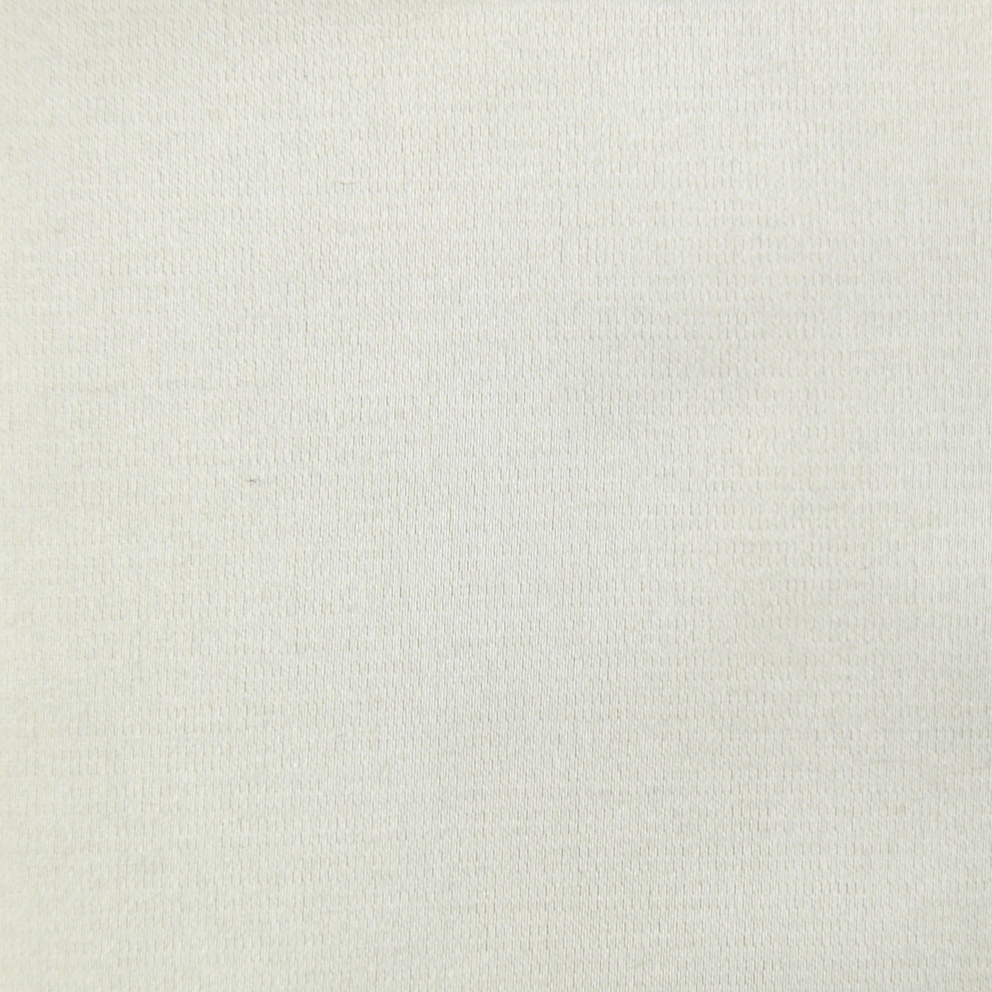 Close-up of ivory woven fabric texture on Ann Gish Duchess pillow.