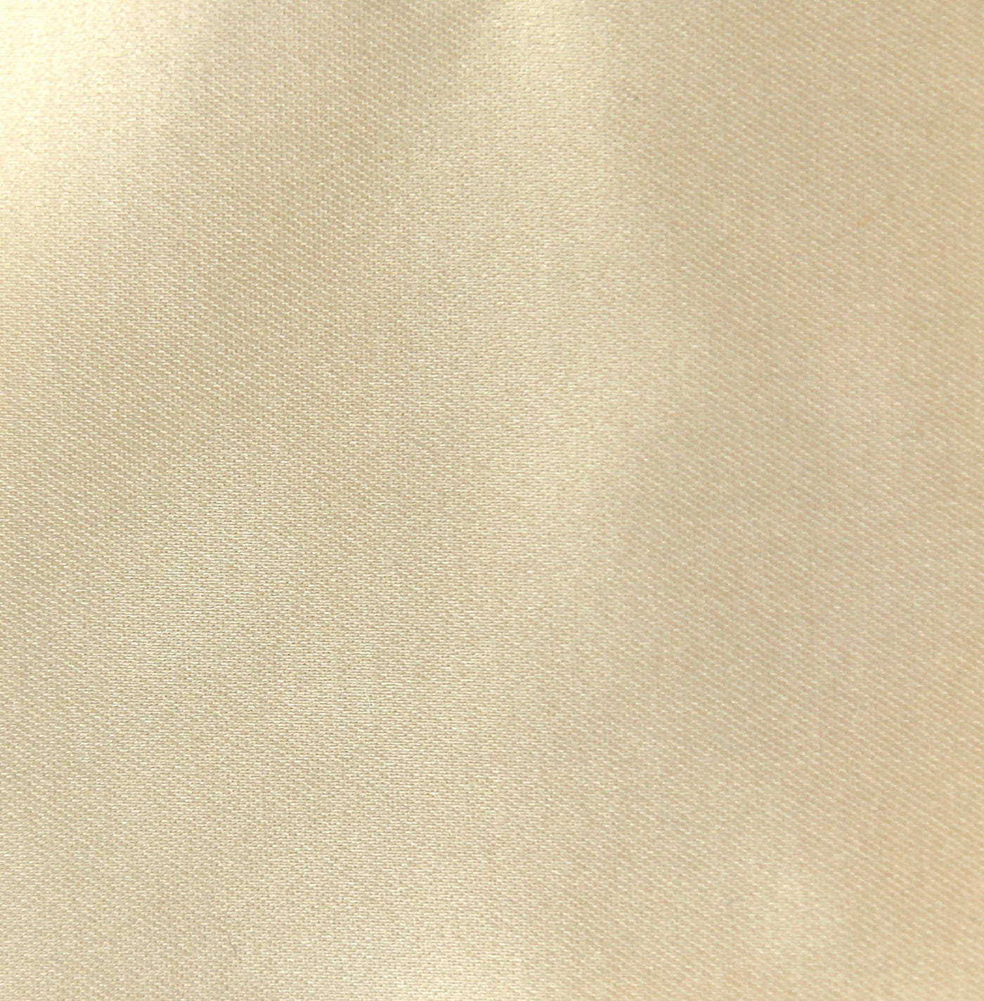 Close-up of champagne satin fabric weave with subtle sheen variation.