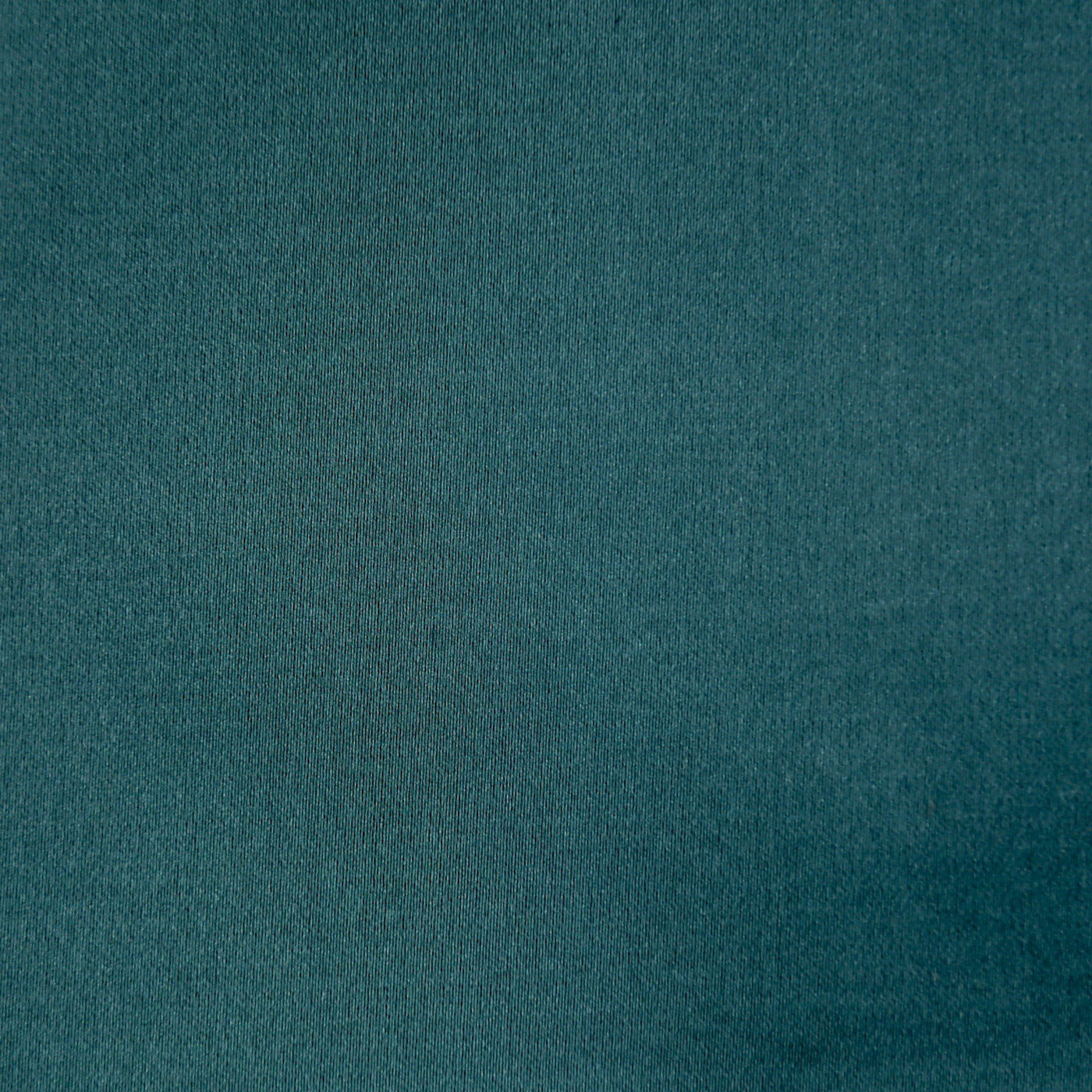 Close-up of teal velvet fabric texture on Ann Gish Duchess pillow.