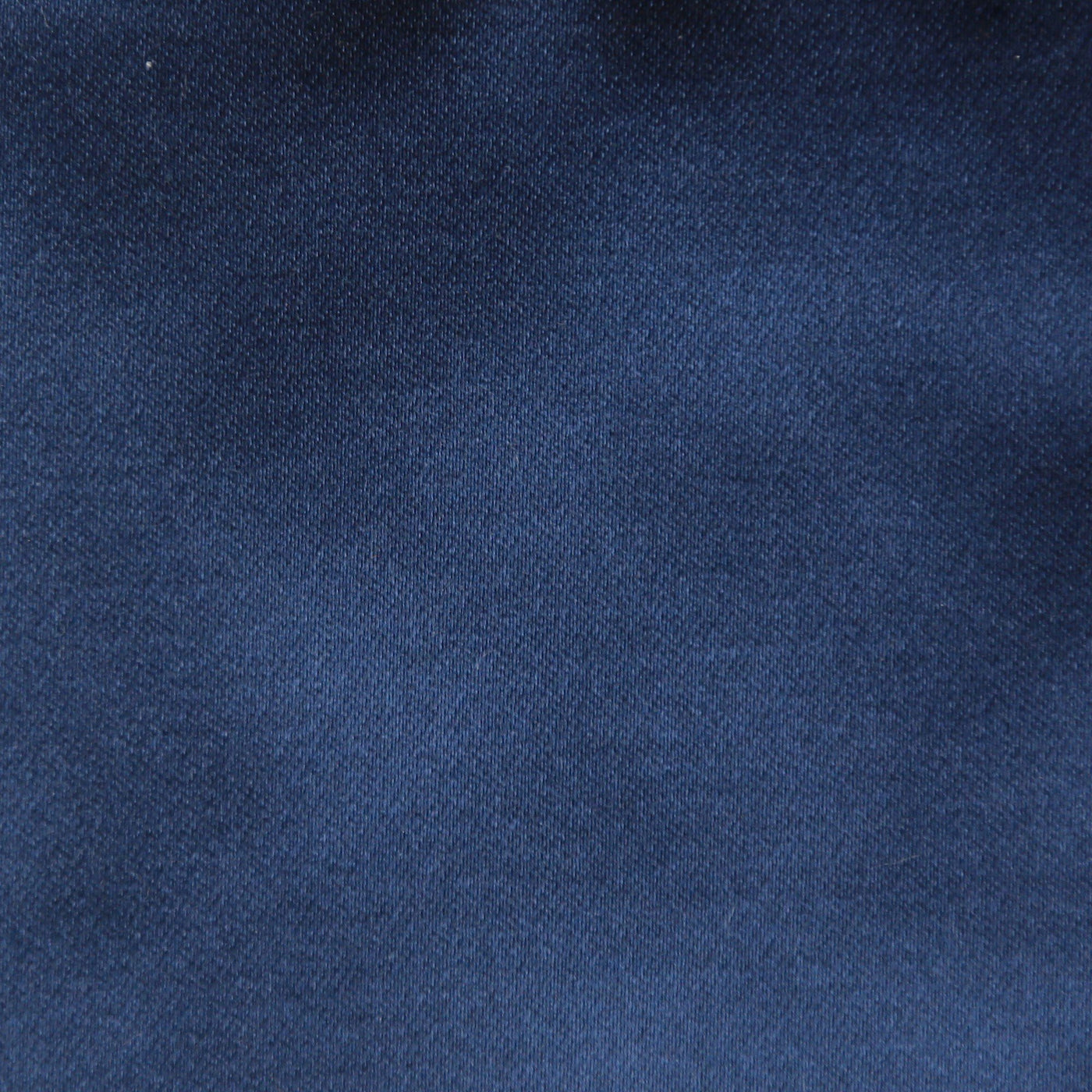 Close-up of Ann Gish Duchess pillow fabric in navy, showing smooth woven texture.