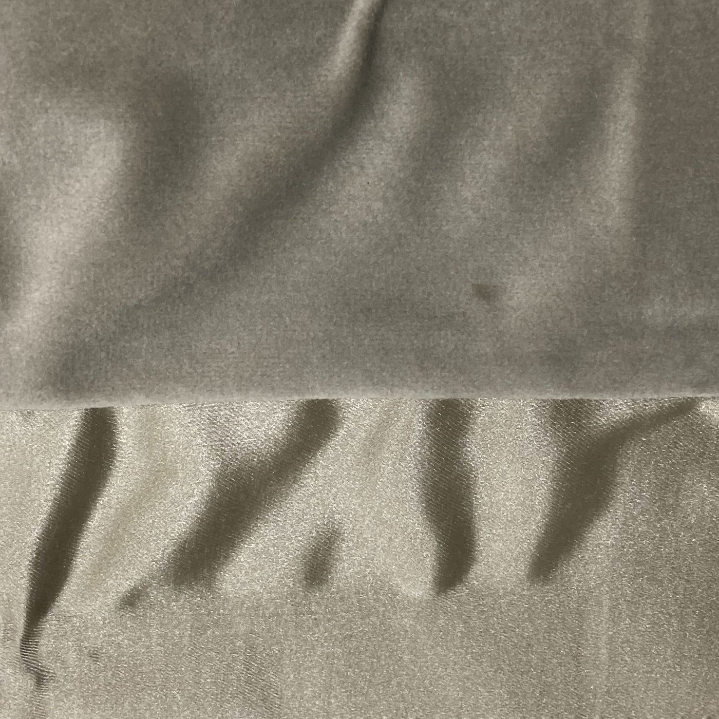 Close-up of Ann Gish Duchess pillow showing taupe velvet and satin reverse fabric textures.