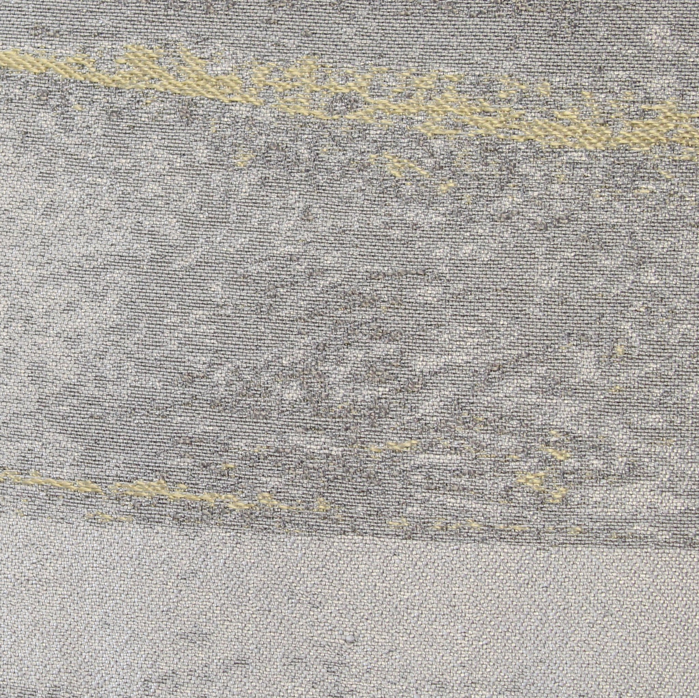 Close-up of Ann Gish Horizon duvet cover in silver-grey with gold embroidered detail.