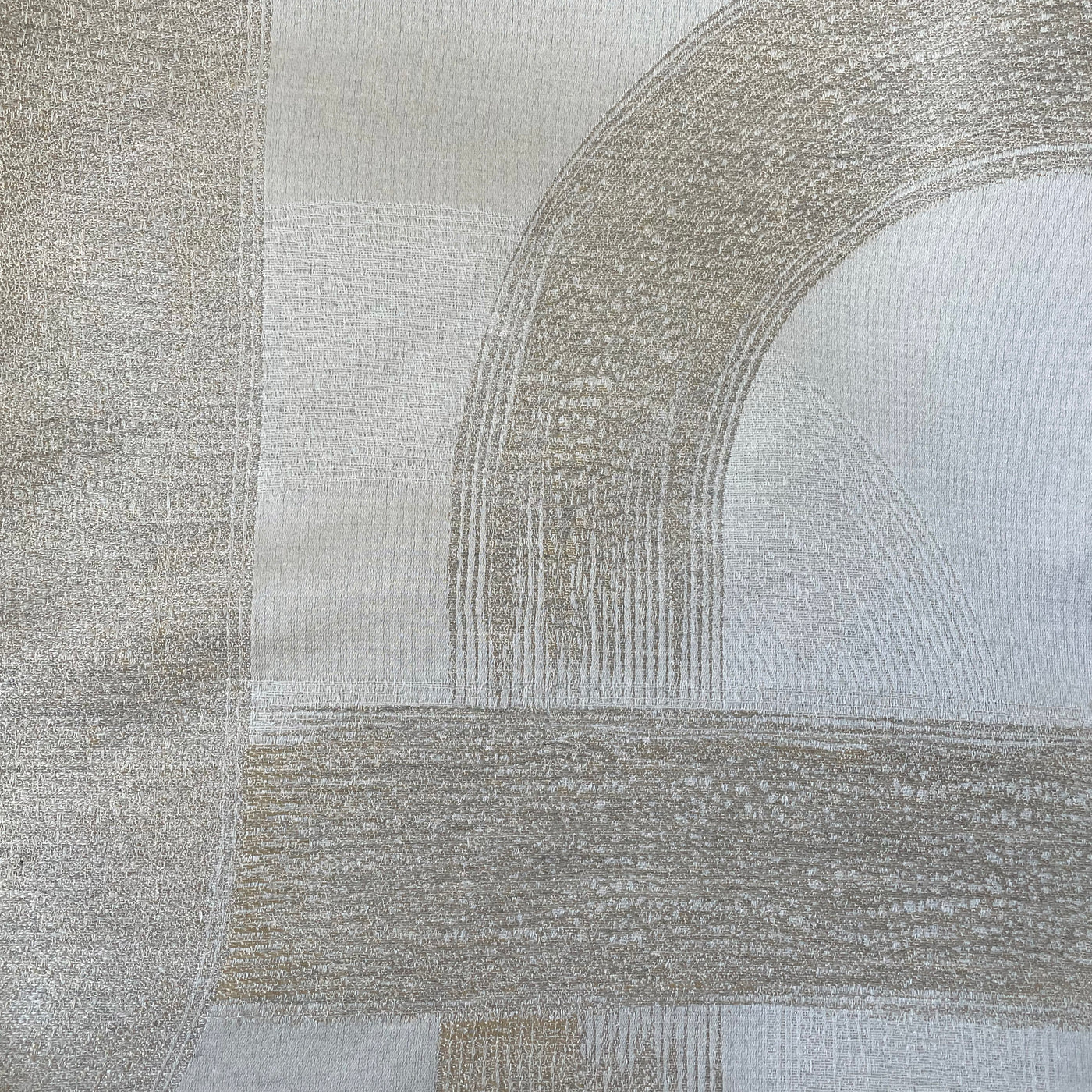 Close-up of Ann Gish Interchange duvet cover showing champagne geometric arch jacquard weave.