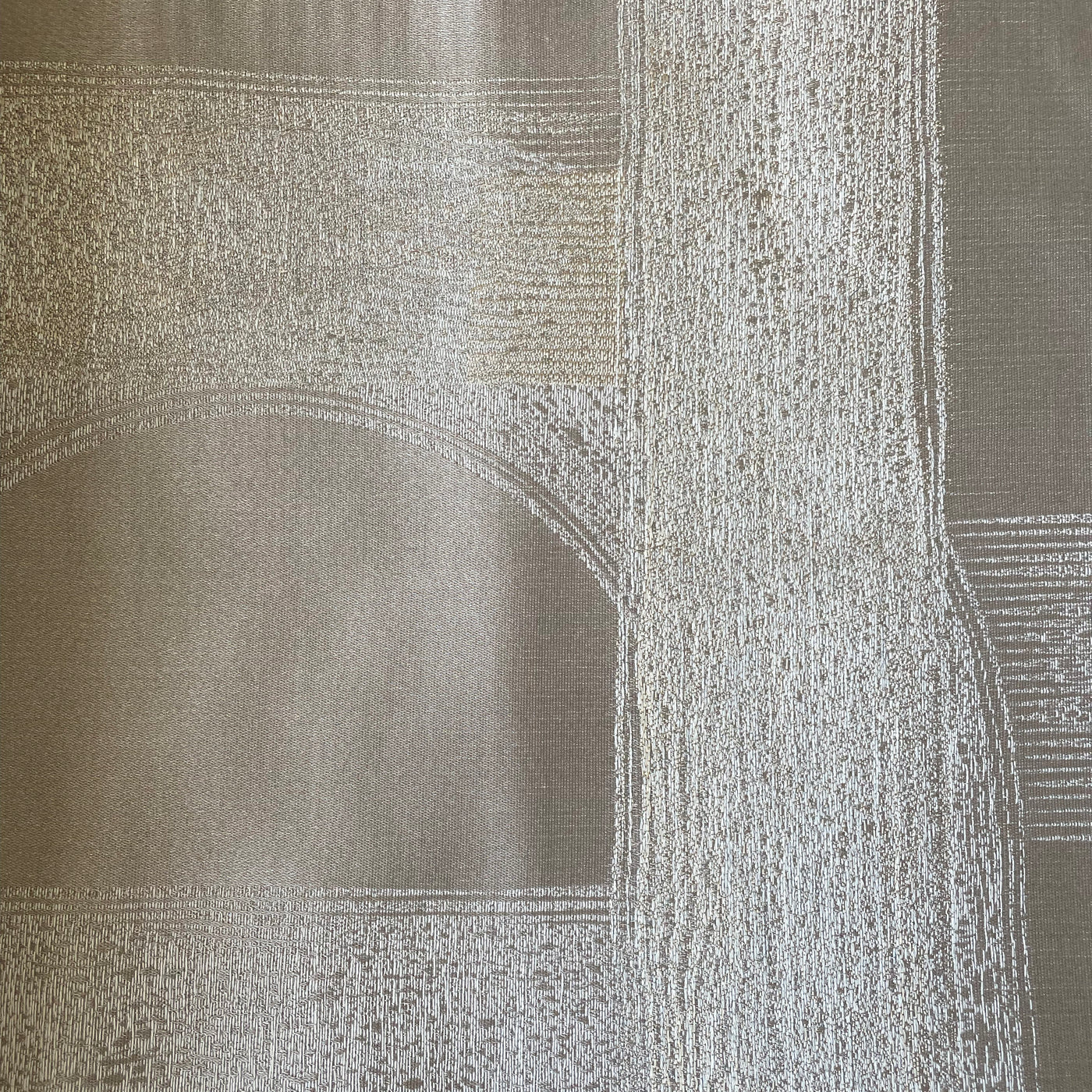 Close-up of Ann Gish Interchange duvet cover in taupe, showing jacquard arch pattern detail.