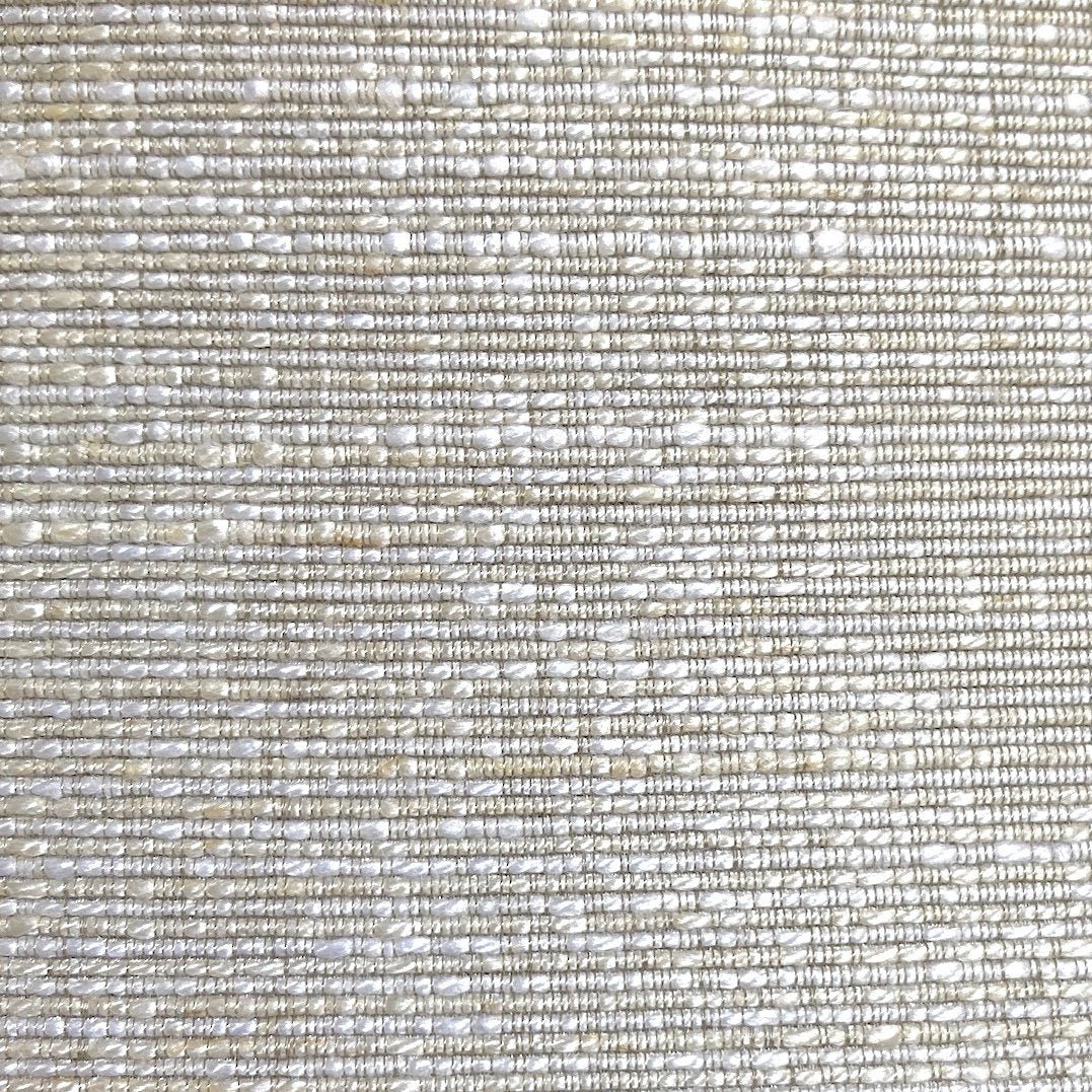 Close-up of Ann Gish Isla duvet cover weave texture in silver and ivory tones.