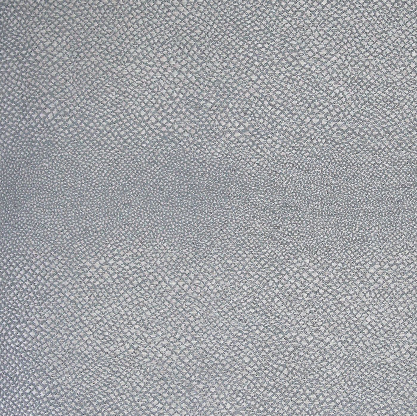 Close-up of Ann Gish Komodo coverlet showing slate blue reptile-scale jacquard weave texture.