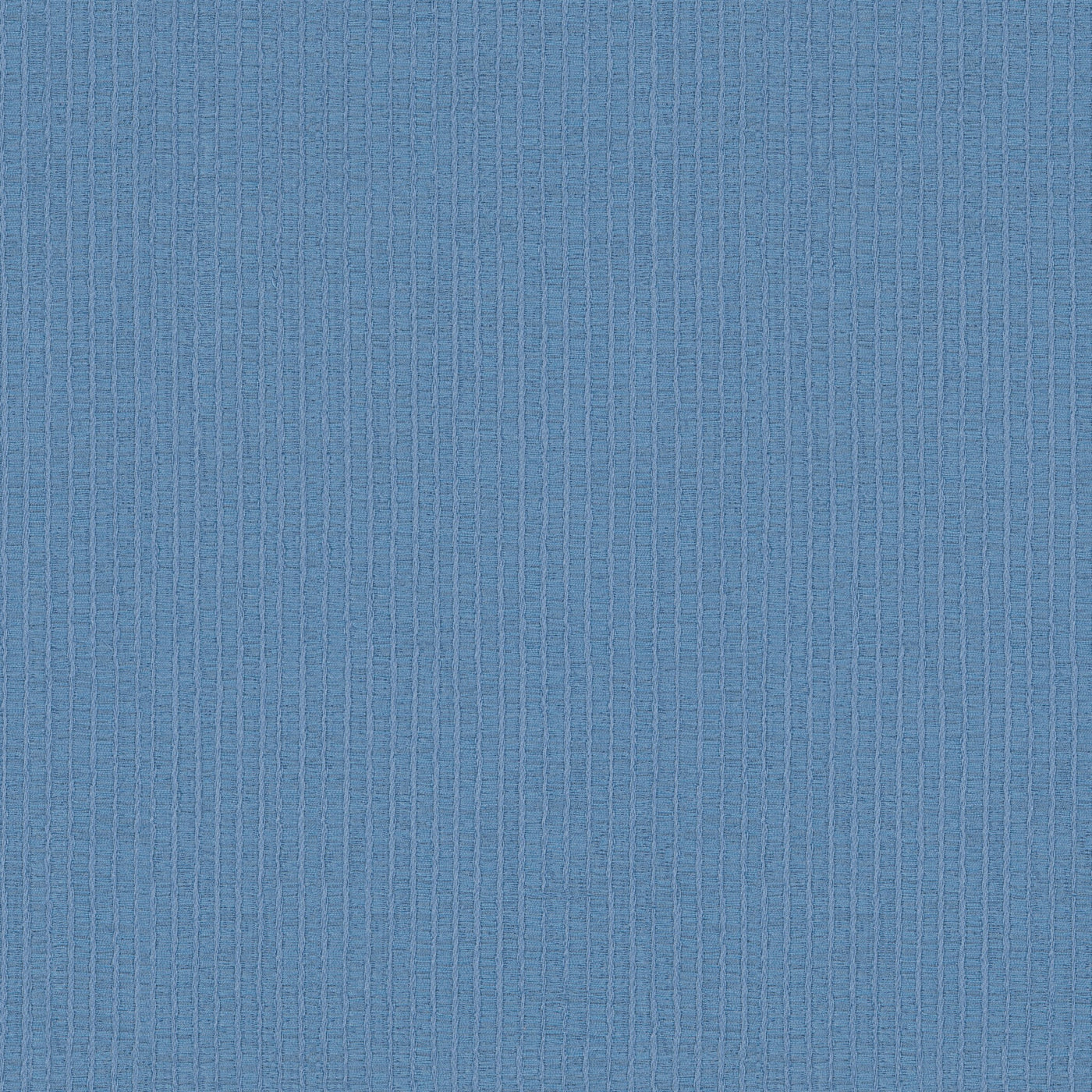 Close-up of Ann Gish Lamina coverlet in cornflower blue, showing subtle vertical stripe weave texture.