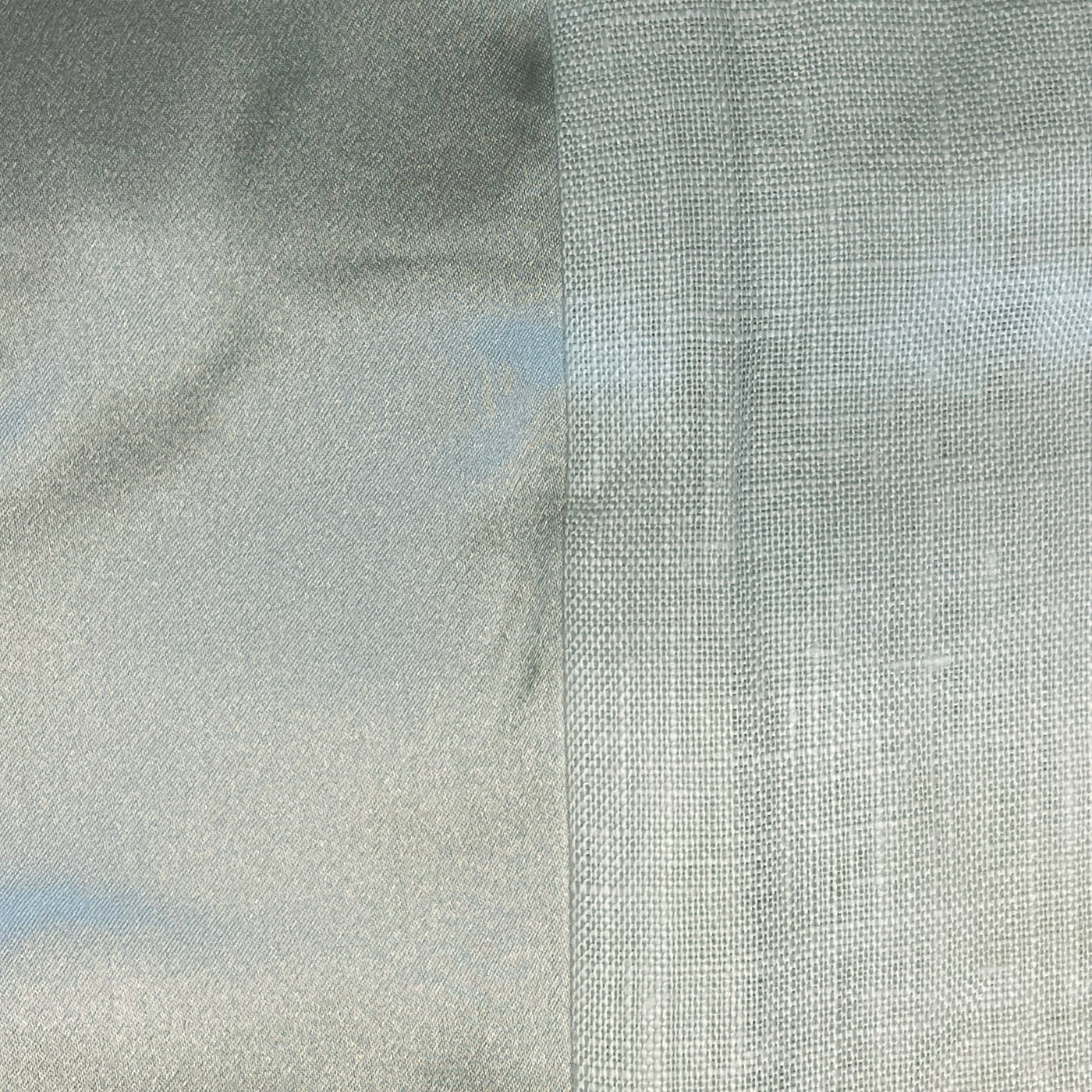 Side-by-side close-up of two silver-grey fabric weave textures, smooth versus open linen weave.