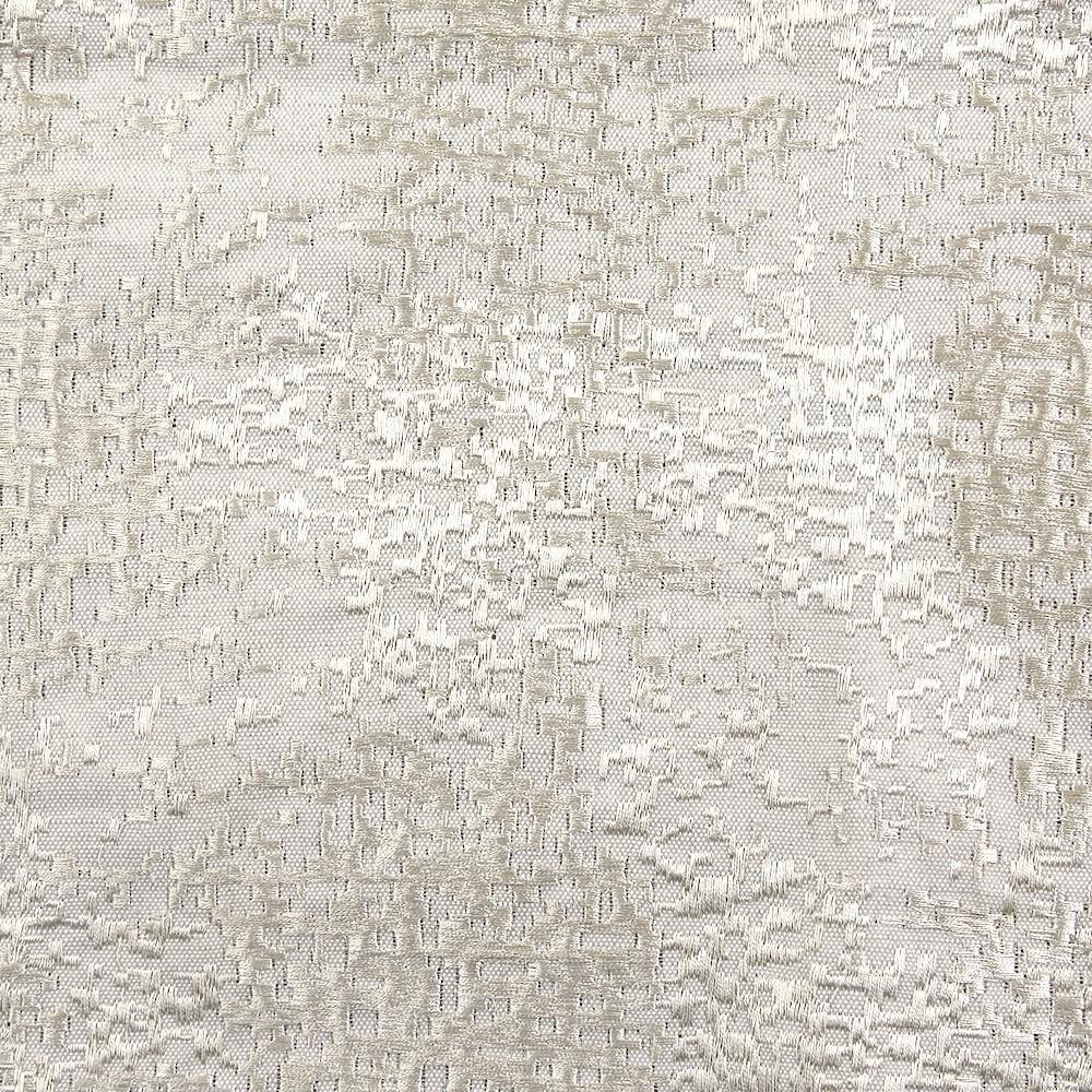 Close-up of Ann Gish Markham pillow fabric in ivory, showing textured jacquard weave pattern.